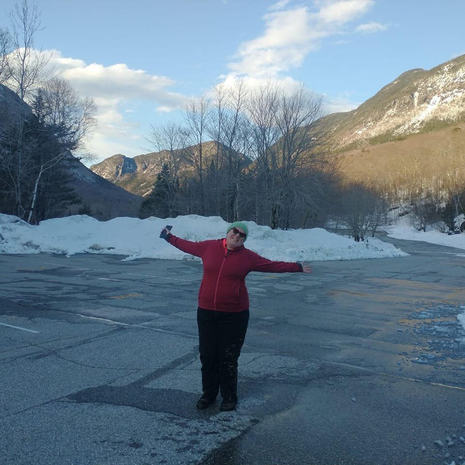 multicolored water droplet in a puddle